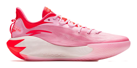 Pink basketball shoe with red trim, lace-up front, and textured midfoot sole