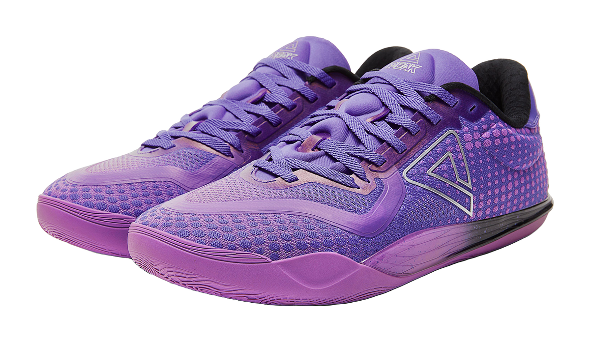 Pair of crystal purple basketball shoes with purple laces and padded collar