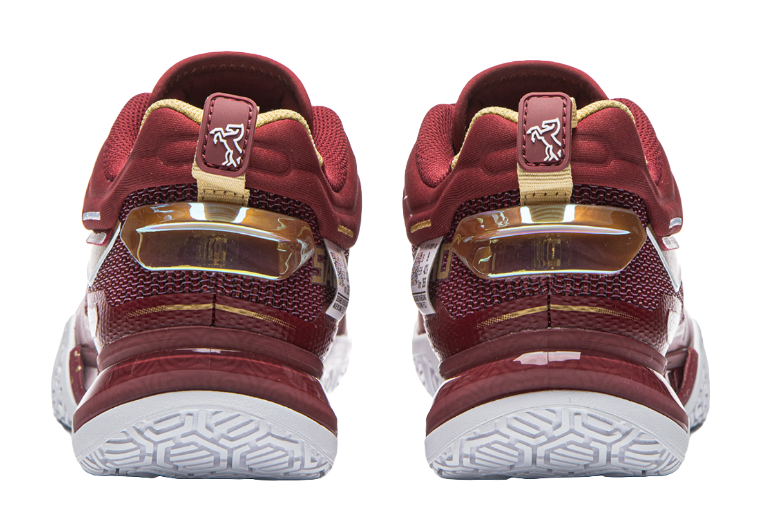 Red badminton shoe back view with strap tab, heel cushioning, and white tread outsole.