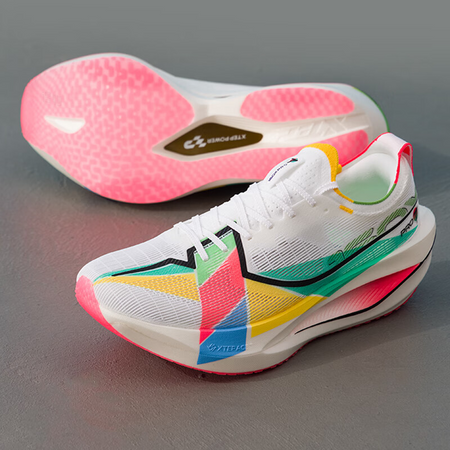 Xtep marathon racing shoe showing white upper, pink outsole, and multicolor side accents.