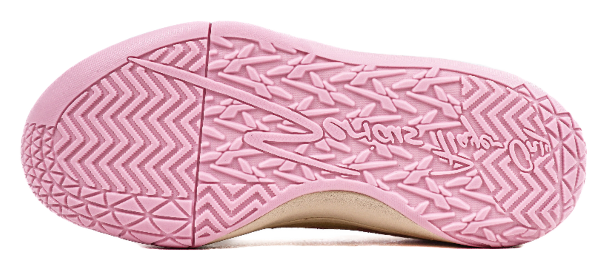 Pink patterned rubber outsole on basketball sneakers with beige sole