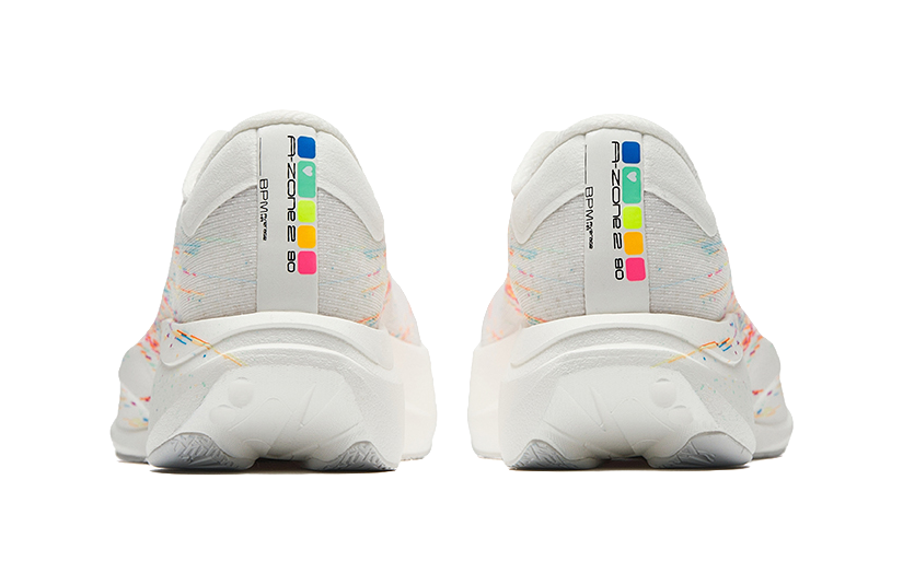 Women’s running shoes, back view—white heel with Zone 2 branding and multicolor accents