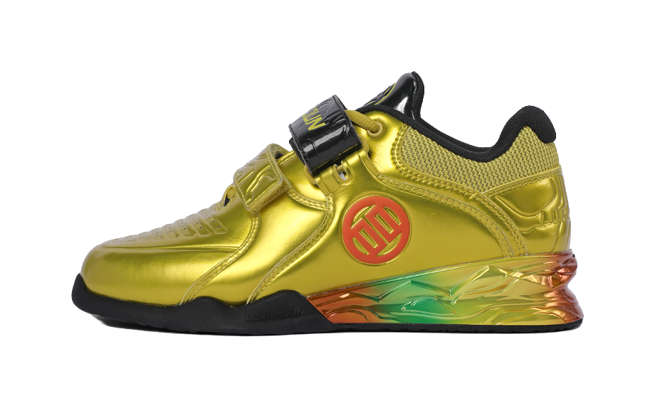 Gold metallic low-top training shoes with black strap and colorful translucent sole