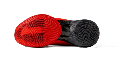 Black and red basketball shoe outsole, side view with textured traction pattern