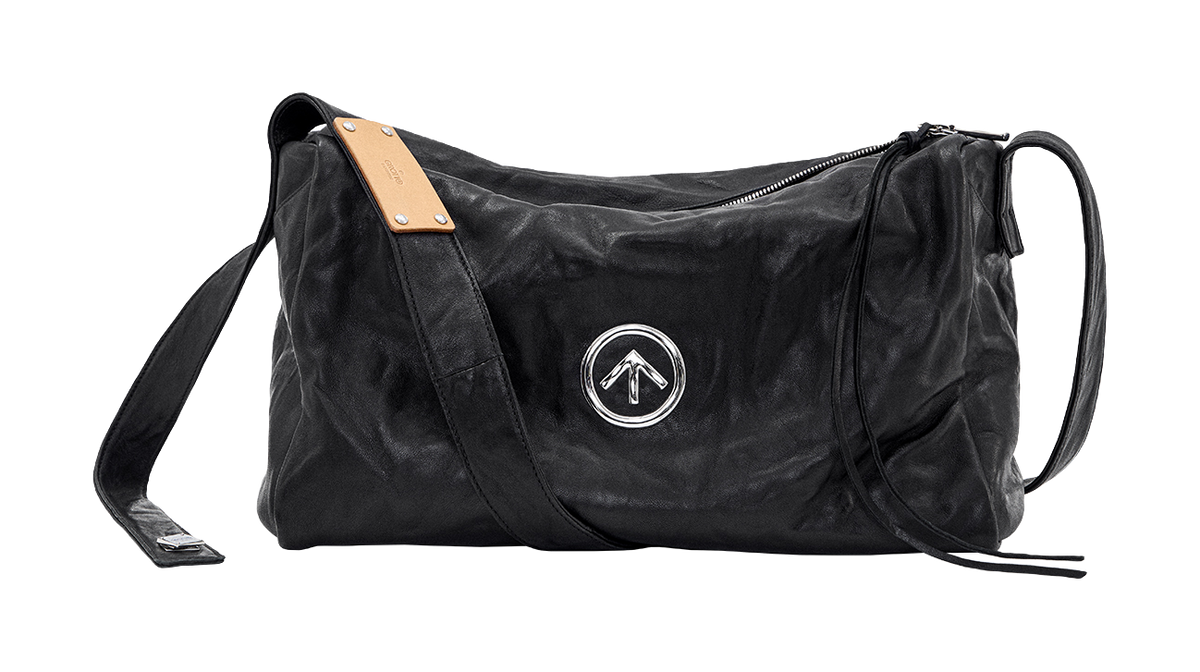 GROTTO black pleated sheepskin crossbody bag with tan label and silver logo emblem