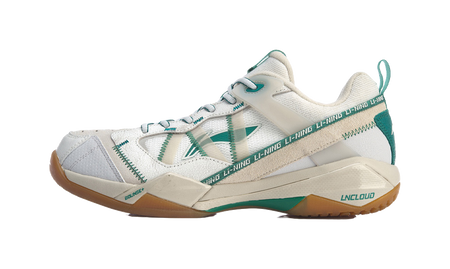 White-and-gray badminton shoe with green accents, side logo, lace-up design