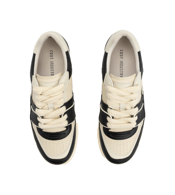 Unisex black and white lace-up sneakers with white interior lining and padded collars