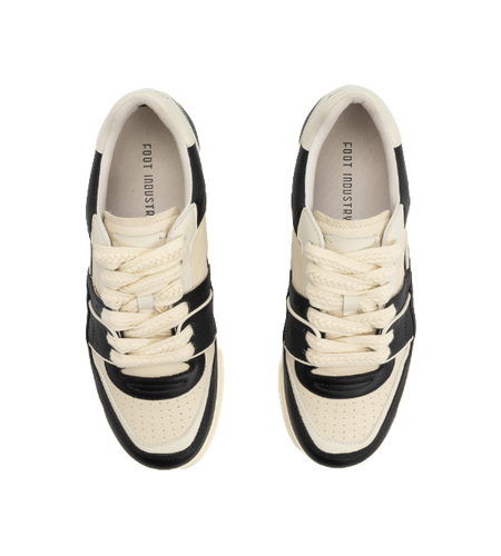 Unisex black and white lace-up sneakers with white interior lining and padded collars