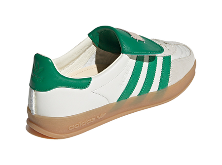 Low-top Gazelle skate shoes with green heel, white upper, lace-up, gum sole