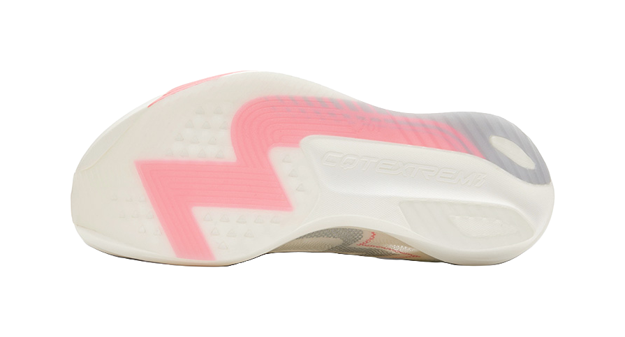 Outsole view of low running shoe in white with pink and gray traction pattern.