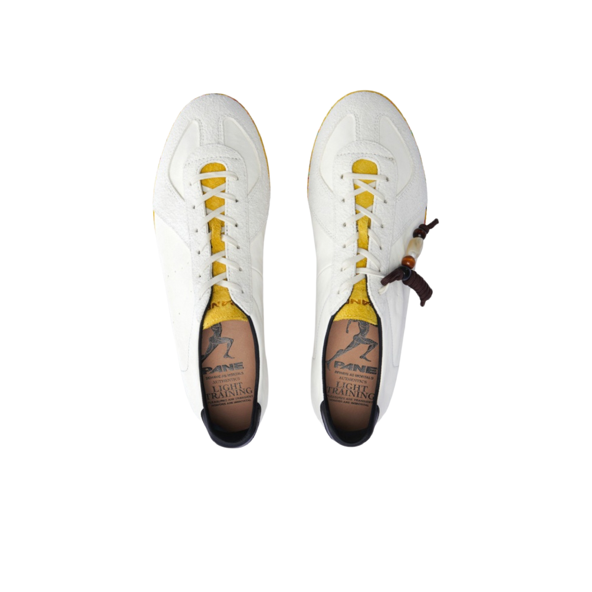 Low-top shoes with white laces and white leather uppers, dark accents on lining