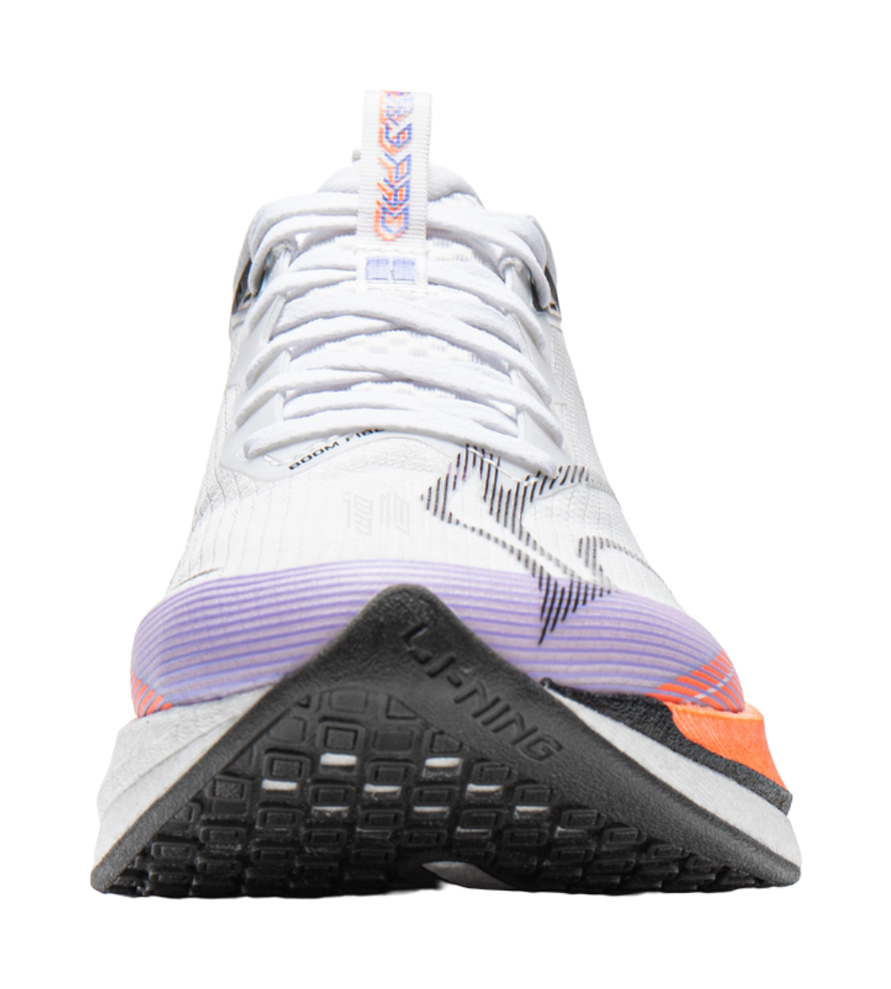 White running shoe close-up with orange-blue embroidery and purple outsole edge