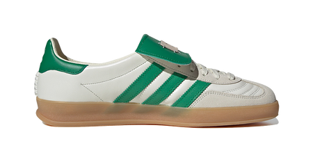 Low-top Gazelle skate shoes with white leather, green three-stripe overlays, gum sole