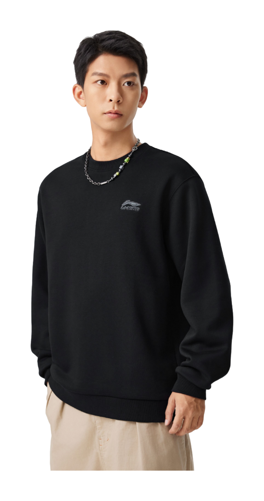 Black fleece-lined crewneck pullover on model, long sleeves, relaxed fit
