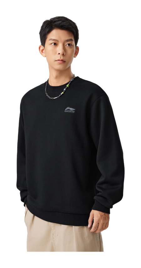 Black fleece-lined crewneck pullover on model, long sleeves, relaxed fit