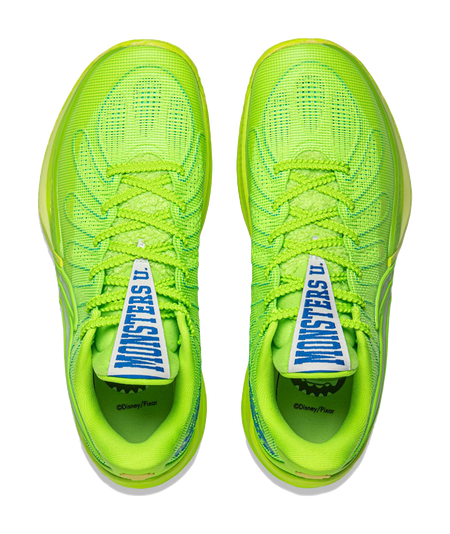 Green lace-up basketball shoe showing blue tongue label
