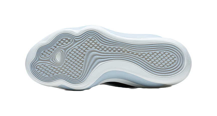 White basketball shoe outsole with patterned traction and cushioning ridges