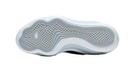 White basketball shoe outsole with patterned traction and cushioning ridges