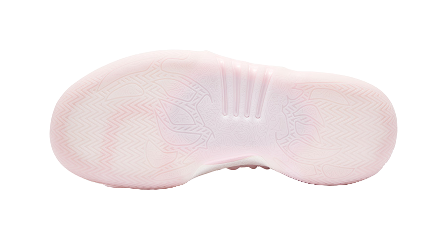 Light pink basketball shoe outsole with traction tread pattern