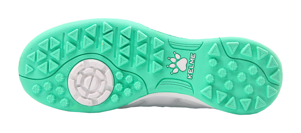 Kelme TF training soccer shoes, mint green outsole with turf studs.