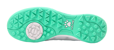 Kelme TF training soccer shoes, mint green outsole with turf studs.