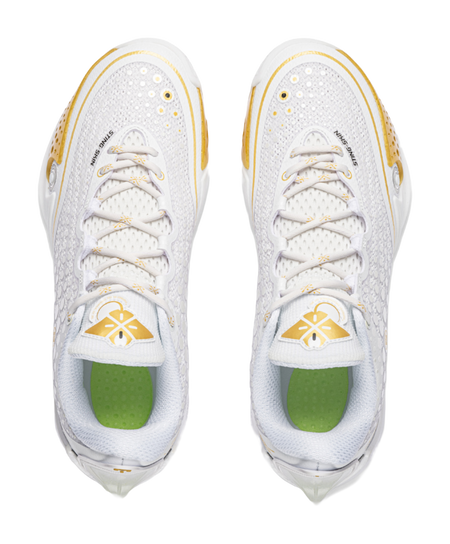 Pair low basketball shoes, white lace-up uppers with gold trim; green interior lining