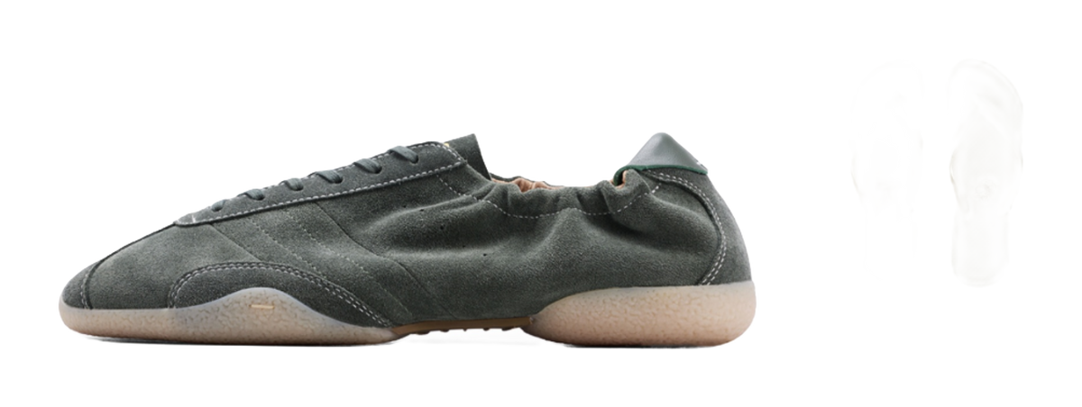 Dark green low-top sneakers with matching insole and slip-on accessory