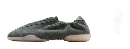 Dark green low-top sneakers with matching insole and slip-on accessory