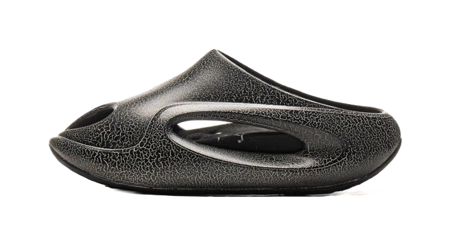 Black textured slide slippers, side view with oval cutout