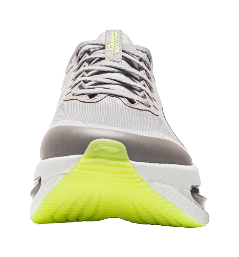 Women's low-top running shoes toe view, calm gray with lace-up and neon green sole