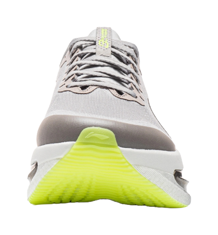 Women's low-top running shoes toe view, calm gray with lace-up and neon green sole