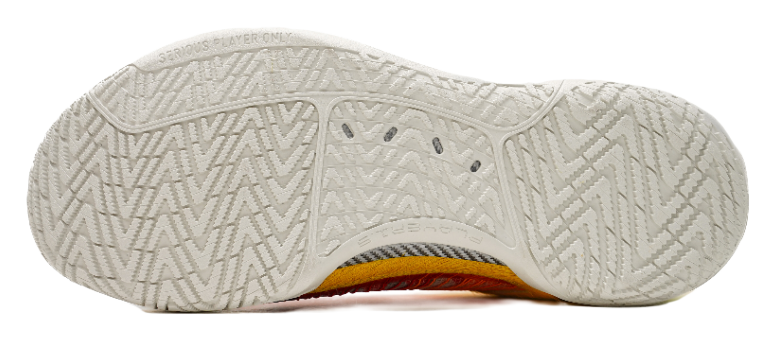 White outsole of multicolor low-top basketball shoes with textured traction pattern
