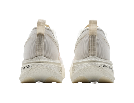 Back view of low-top running shoes in white with red accents and pull-tab heel loops.