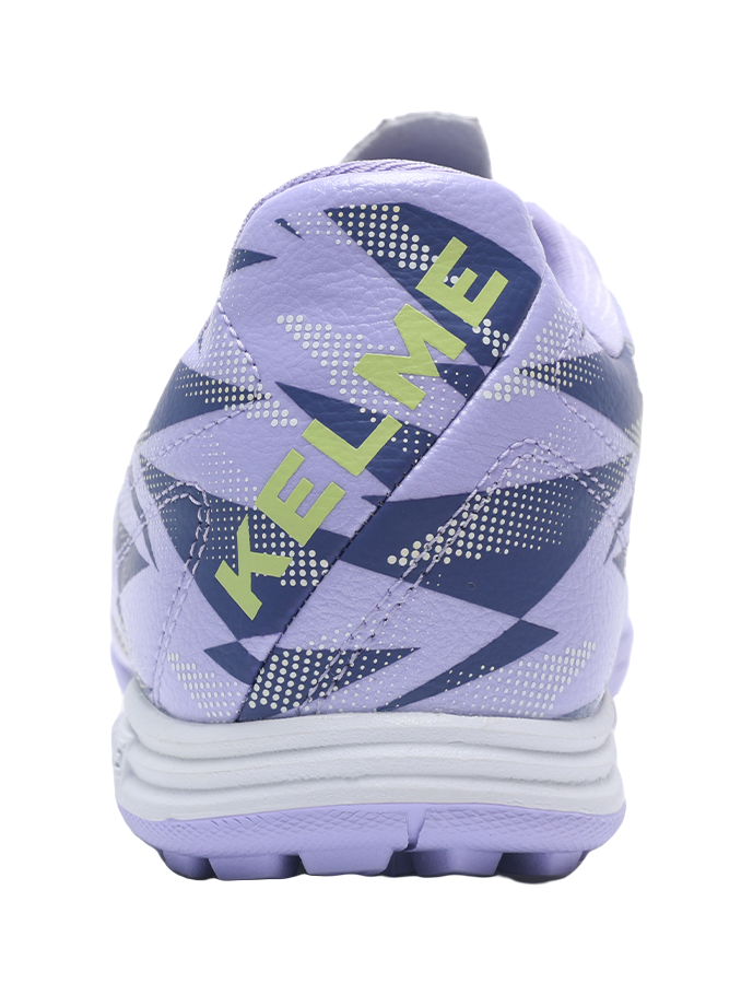 Lilac purple TF turf soccer shoes, rear view with heel pull tab and blue geometric print