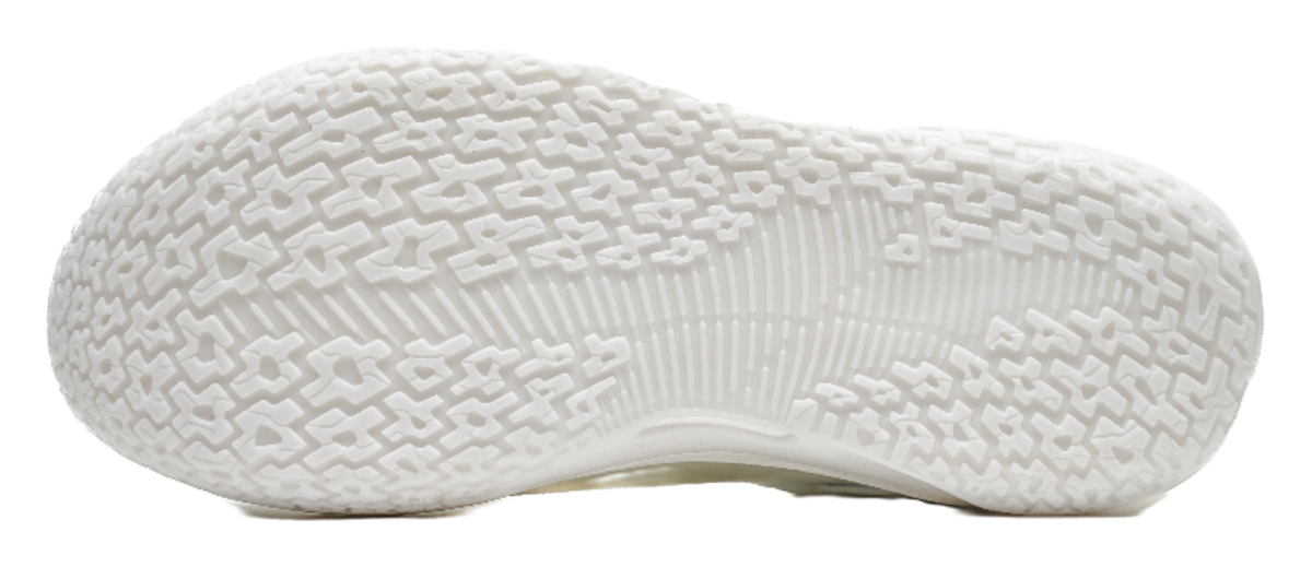 Sole of pure white basketball shoes with textured traction pattern