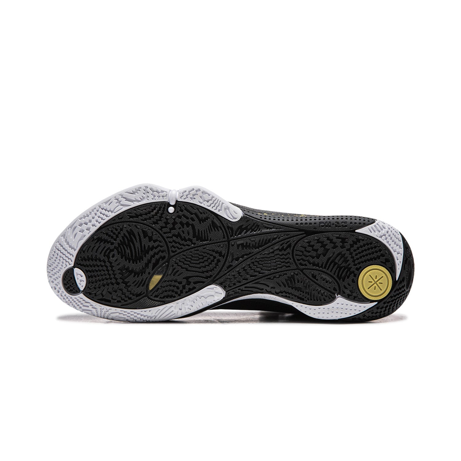 Basketball shoe outsole in black with textured traction and gold circular mark