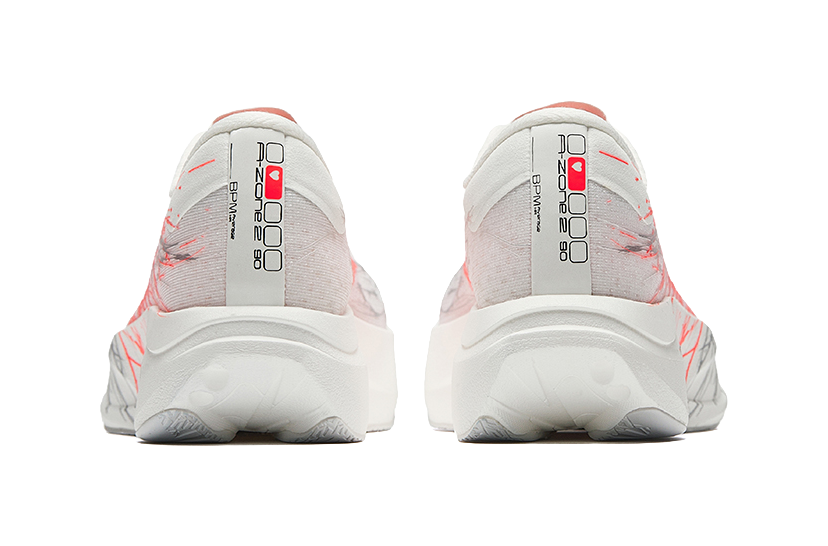 Women's low-top running shoes heel view, white fabric with red streak accents