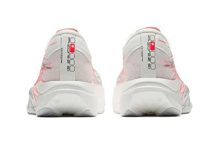 Women's low-top running shoes heel view, white fabric with red streak accents