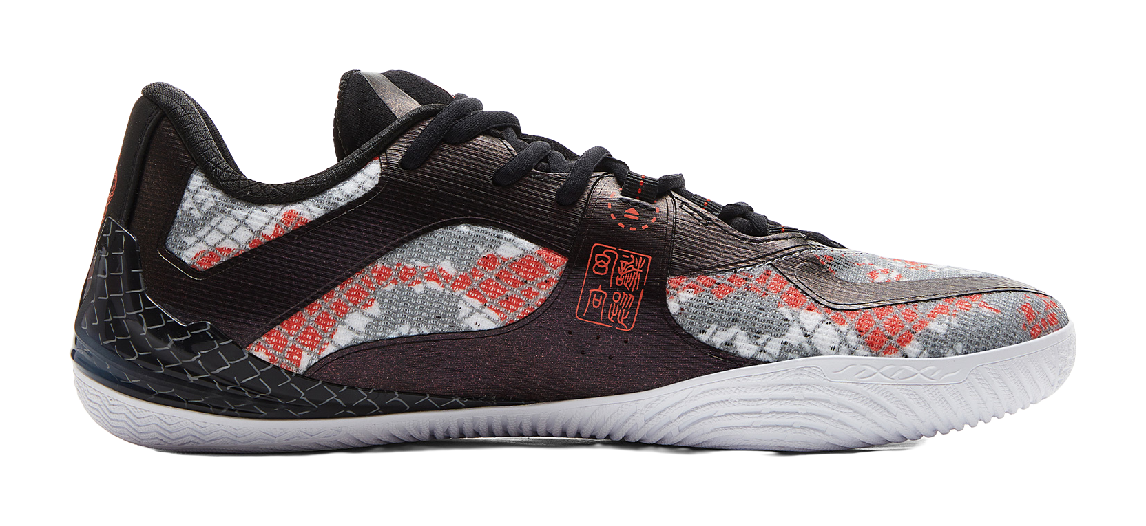 Side view basketball shoe with speckled upper, black overlays, red accents