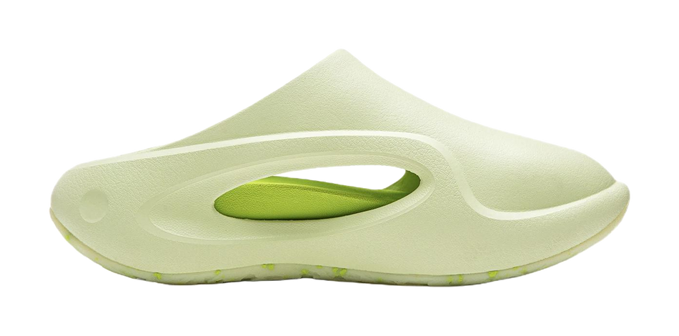 Unisex slide slippers angled view, light green slide with oval lime cutout
