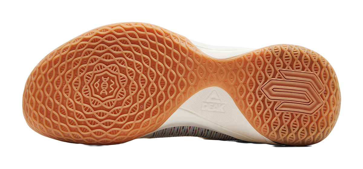 Gum rubber outsole with waffle traction pattern and basketball-shoe logo marks