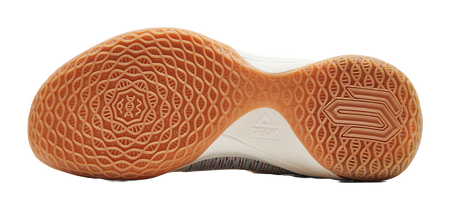 Gum rubber outsole with waffle traction pattern and basketball-shoe logo marks