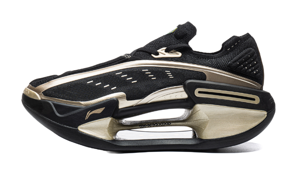Black low-top running shoe with white midsole and gold accents