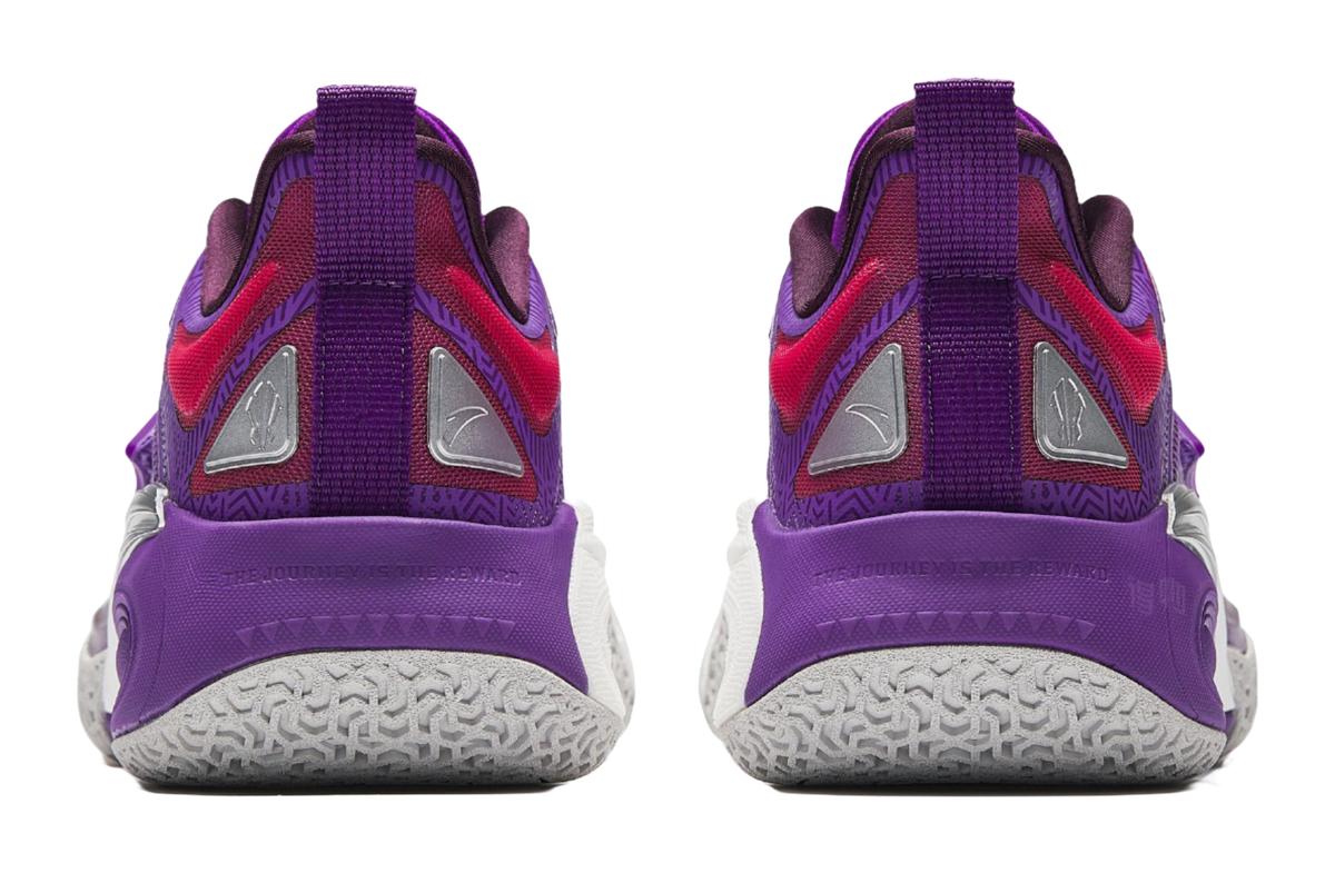 Purple basketball shoes with red heel panels, gray sole tread, and back pull tabs.