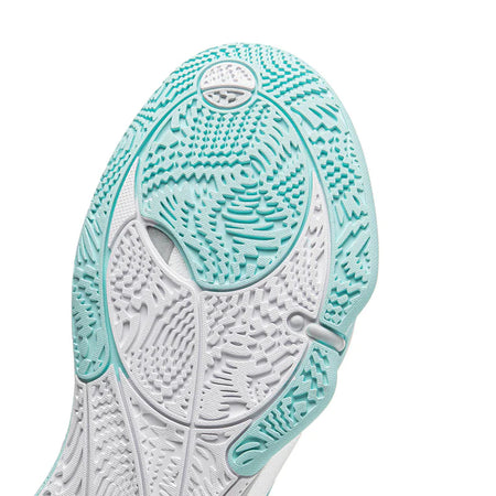 Close-up of shoe outsole with teal and gray tread for grip and cushioning.