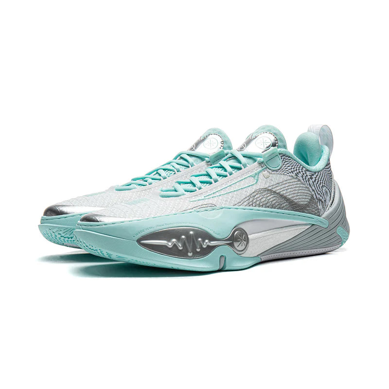 Low-top basketball shoe in blue-gray with mint accents, lace-up with padded collar.