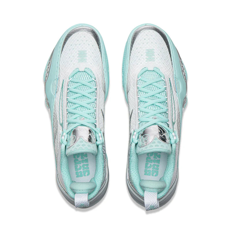 Pair of low-top basketball shoes in white, blue-gray, and mint with mint lace-up.