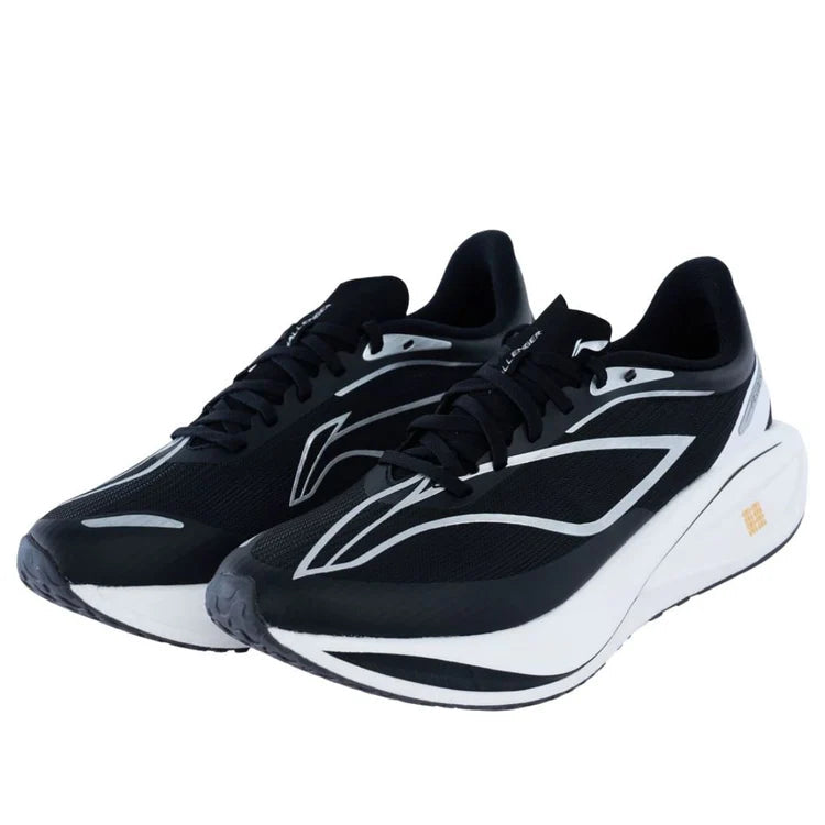Men's black and white running shoes, front view with lace-up mesh and thick white midsole