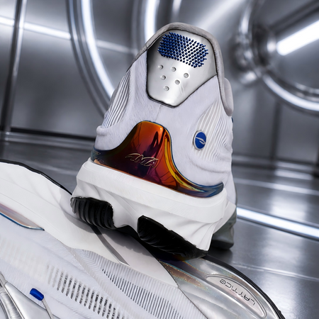 Silver basketball shoe heel and outsole detail with blue heel pad and rainbow panel