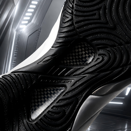 Black basketball shoe outsole and upper edge detail with traction lugs and grooves